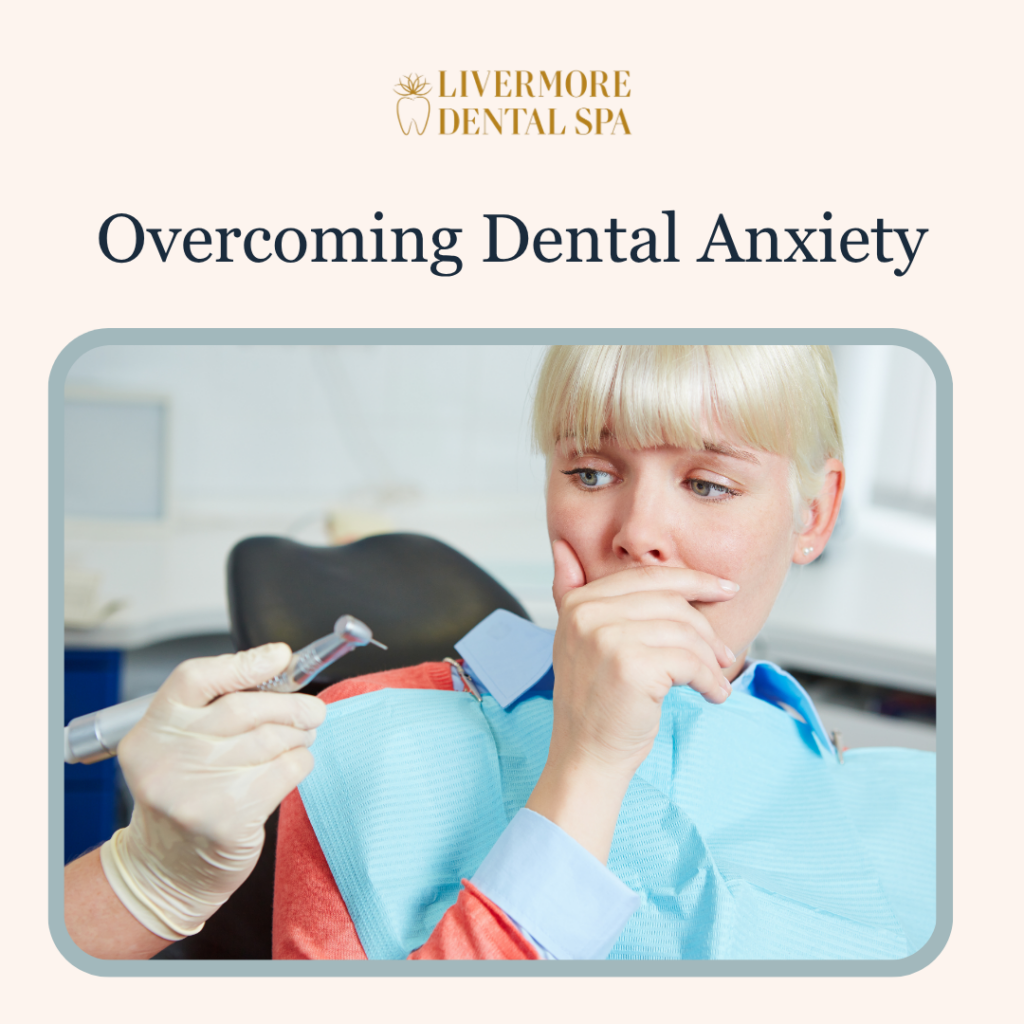 A relaxed patient smiling during a comfortable dental checkup at Livermore Dental Spa, representing overcoming dental anxiety.